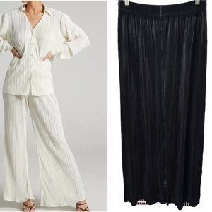 JUTKA & RISKA black wide leg high waist Accordion pleated trouser pants put on